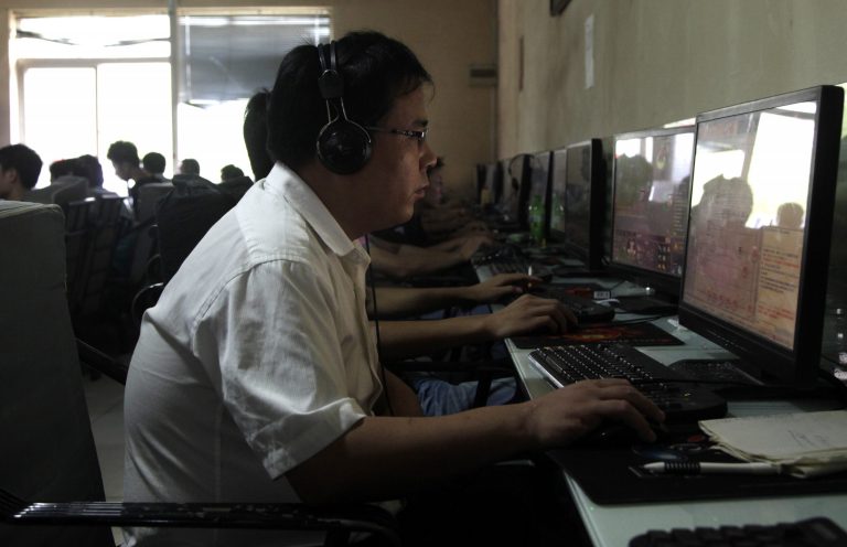   FILE - In this July 14, 2010 file photo, a Chinese man uses a computer at an Internet cafe in Beijing. China's new communist leaders are increasing already tight controls on Internet use and electronic publishing following a spate of embarrassing online reports about official abuses. The measures suggest China's new leader, Xi Jinping, and others who took power in November 2012 share their predecessors' anxiety about the Internet's potential to spread opposition to one-party rule and their insistence on controlling information despite promises of more economic reforms. (AP Photo/Ng Han Guan, File)  