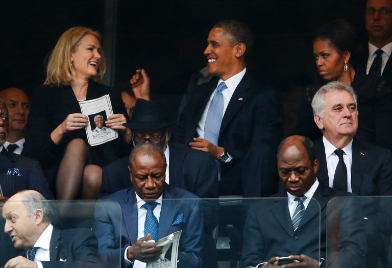 Obama laughs, takes selfie at Nelson Mandela funeral