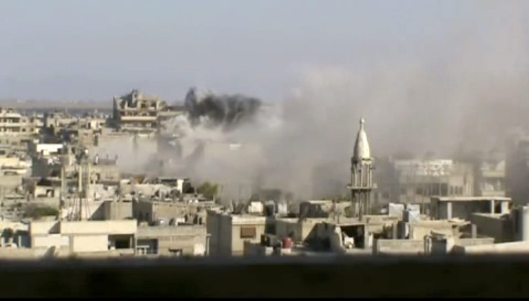   This image made from amateur video released by Shaam News Network and accessed Friday, June 8, 2012, purports to show explosions in the Khaldiyeh area of Homs, Syria. Syrian troops on Friday heavily shelled a rebel-held neighborhood in the flashpoint central city of Homs as President Bashar Assad's troops appeared to be readying to storm the area that has been out of government control for months and it was not clear if U.N. observers were able to enter an area where a massacre occurred this week, activists said. (AP Photo/Shaam News Network via AP video)THE ASSOCIATED PRESS CANNOT INDEPENDENTLY VERIFY THE CONTENT, DATE, LOCATION OR AUTHENTICITY OF THIS MATERIAL  