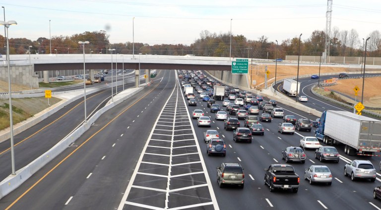 Soon to be opened express lanes are empty, left, as northbound traffic is heavy on Interstate 495, the Capital Beltway, near Tysons Corner in Fairfax County, Va., Saturday, Nov. 10, 2012. The four Express Lanes, two northbound and two southbound, supplement the existing eight lanes on the Virginia side of the Beltway. (AP Photo/Cliff Owen)
