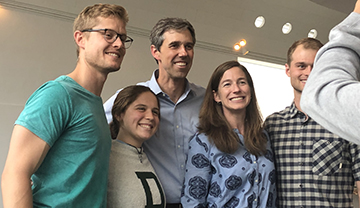 Beto O'Rourke, center, and Amy O'Rourke, second from the right, take photos at Dartmouth College.