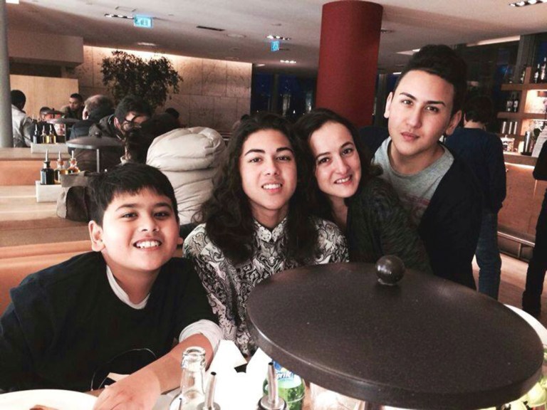 In this undated photo released by the Calehr family, Miguel Panduwinata, left, Mika Panduwinata, Samira Calehr, second from right, and Shaka Panduwinata, right, pose for a photo. Shaka Panduwinata and his brother Miguel Panduwinata were killed aboard Malaysia Airlines Flight 17, which was shot down over eastern Ukraine. (AP Photo/The Calehr family)