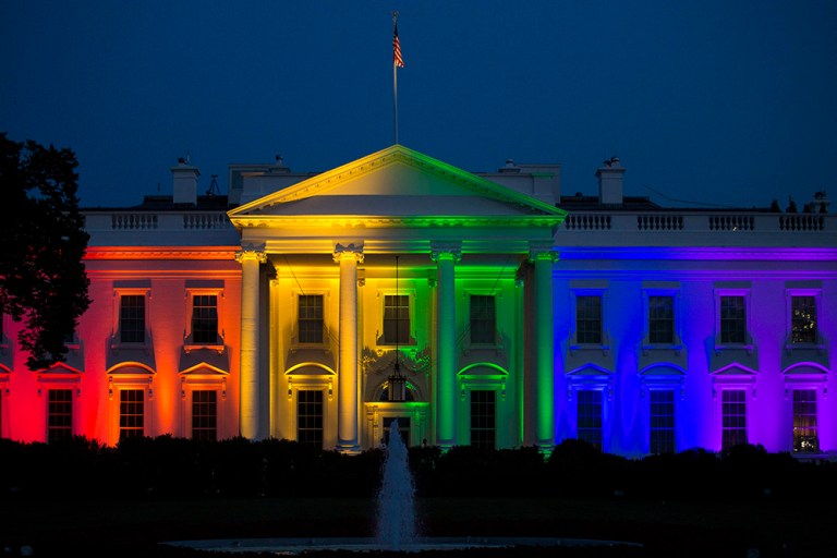 The White House stands illuminated in rainbow colored light at dusk in Washington, D.C., U.S., on Friday, June 26, 2015 in support of gay marriage. (Bloomberg/Drew Angerer)