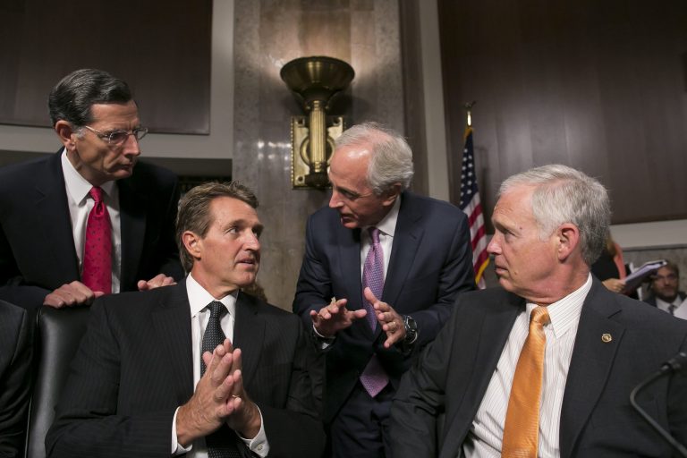 From left, Sen. John Barrasso, R-Wyo., Sen. Jeff Flake, R-Ariz., Sen. Bob Corker, R-Tenn., and Sen. Ron Johnson, R-Wis., speak before a Senate Foreign Relations Committee hearing. President Trump could attempt to contain the criticism from retiring Republicans by moderating his tone and laying off individual attacks on members. (Al Drago/CQ Roll Call via AP)