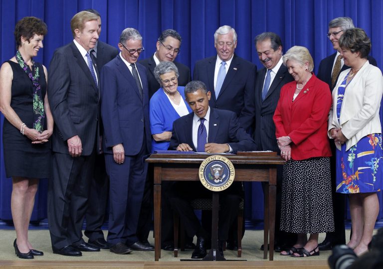 President Obama signs the Export-Import Bank Act of 2012, which reauthorized the agency, on May 30, 2012, in the Eisenhower Executive Office Building in Washington. (AP Photo/Pablo Martinez Monsivais)