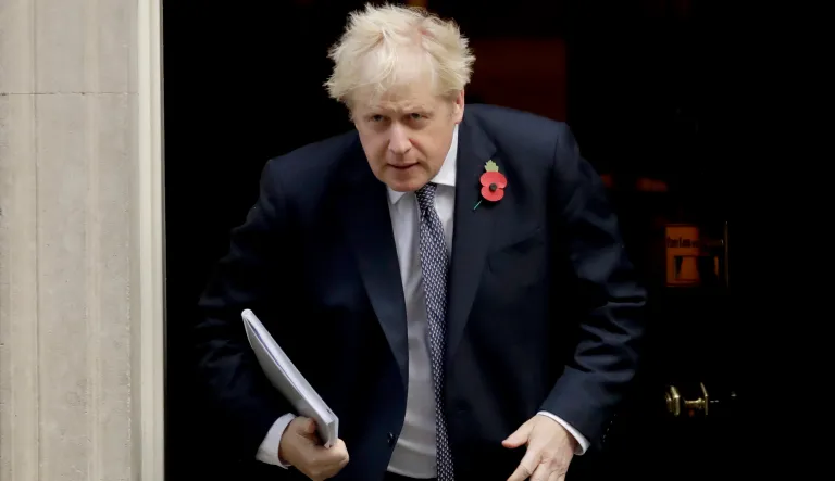British Prime Minister Boris Johnson leaves 10 Downing Street in London, to attend a weekly cabinet meeting at the Foreign, Commonwealth & Development Office, in London, Tuesday, Nov. 10, 2020. (AP Photo/Matt Dunham)