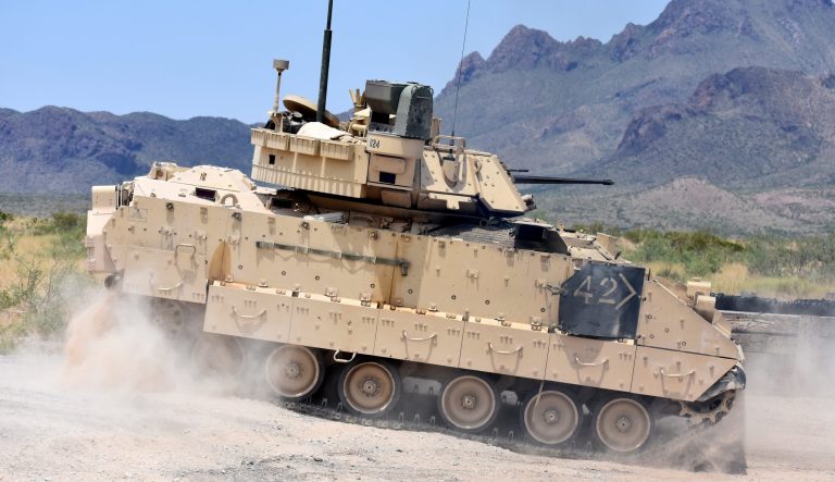 An M2A3 Bradley Fighting Vehicle crew changes position on the range during gunnery training at the DoÃ±a Ana Range Complex, N.M., Aug. 3, 2018.