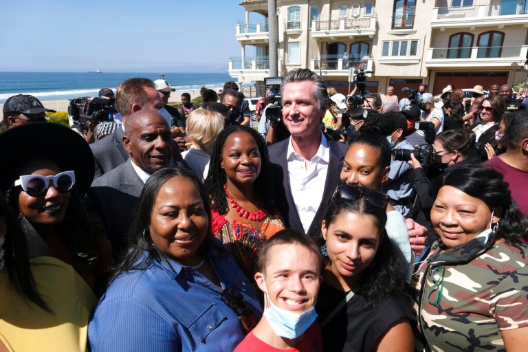 California Gov. Gavin Newsom takes photos with members of the Bruce family and Justice for Bruce's Beach.