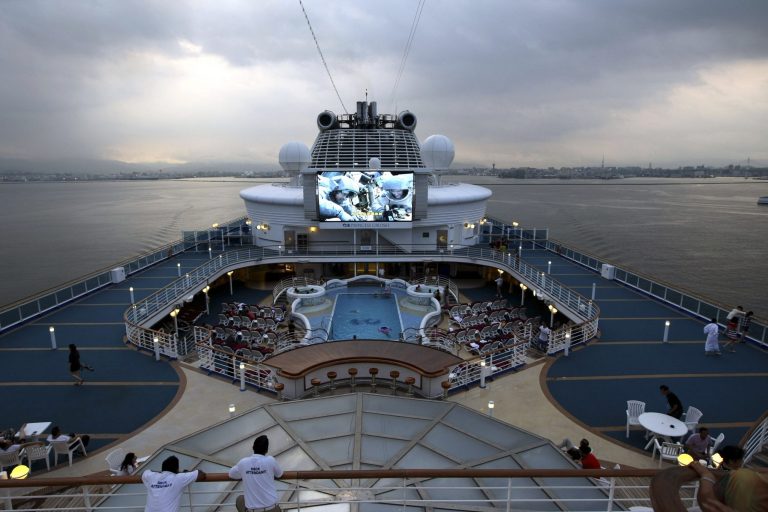 FOR USE WITH STORY CHINA CRUISE BOOM BY KELVIN CHAN In this photo taken Monday Aug. 4, 2014, Chinese tourists on board the Princess Cruises ship Diamond Princess off the coast of Fukuoka, Japan. (AP Photo) CHINA OUT