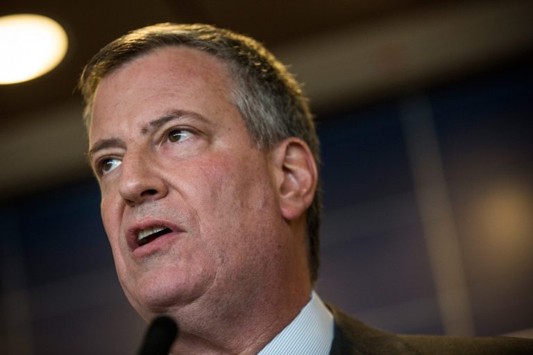 New York City Mayor Bill de Blasio, whose wife is black, said they've had to warn their son to be careful around police. (Photo by Andrew Burton/Getty images)