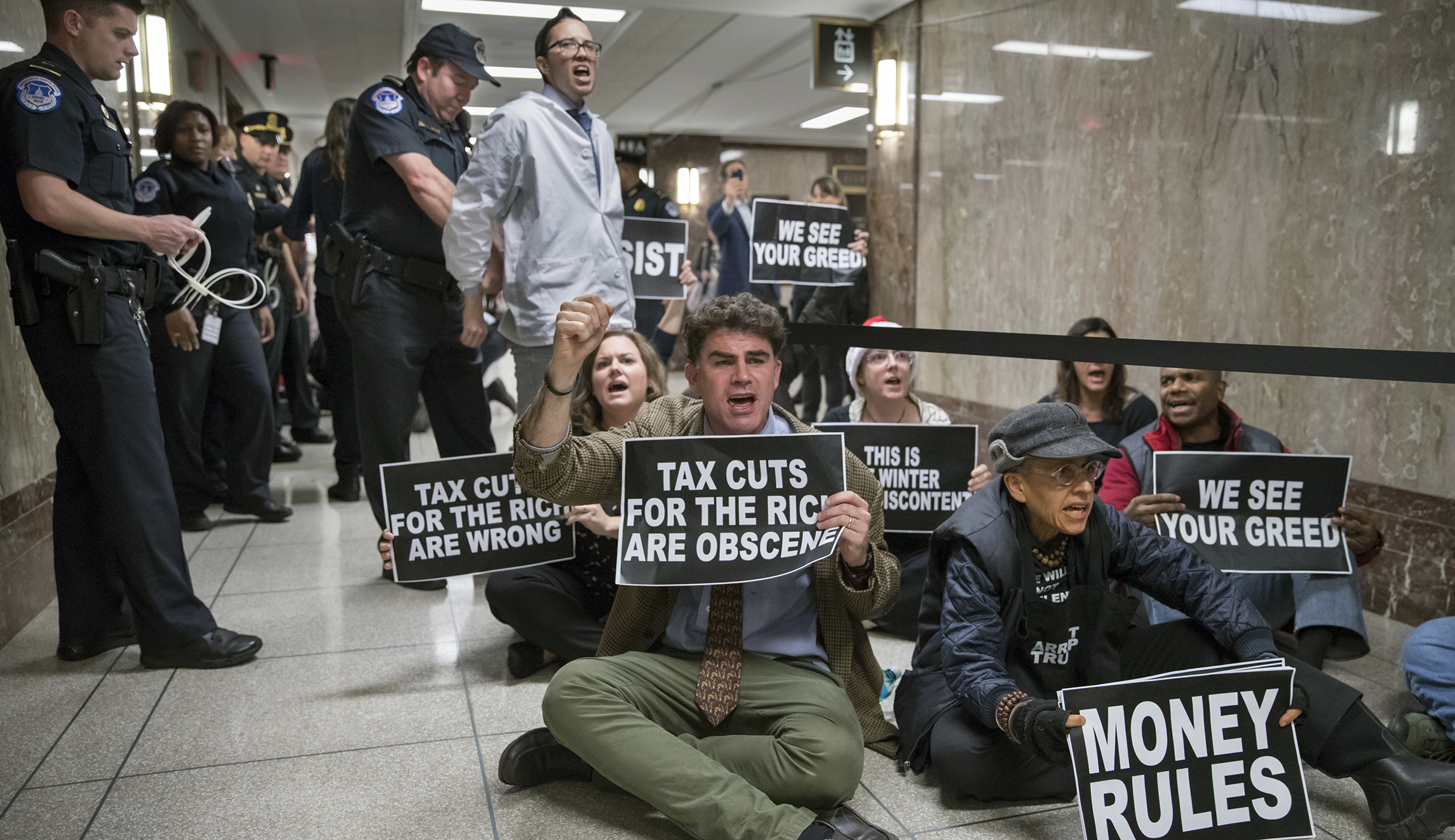 Capitol Police arrest wheelchair-bound protesters at Senate tax bill hearing