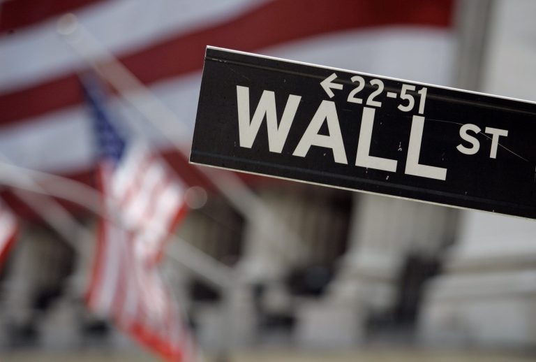 FILE - This May 11, 2007 file photo shows a Wall Street sign in front of the flag-draped facade of the New York Stock Exchange. U.S. stocks edged higher in early trading Thursday, May 22, 2014, extending gains from a day earlier. Investors cheered earnings news from several retailers, including Best Buy, Dollar Tree and L Brands. Sears fell sharply after reporting disappointing results. (AP Photo/Richard Drew, File)
