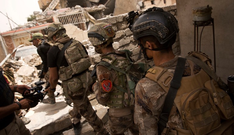 Iraqi special forces advance to their next position in Mosul, Iraq. The Islamic State has been driven out of 90 percent of Mosul and fighters are now confined to an ever-shrinking area of the old city, the Pentagon said Tuesday. (AP Photo/Maya Alleruzzo)