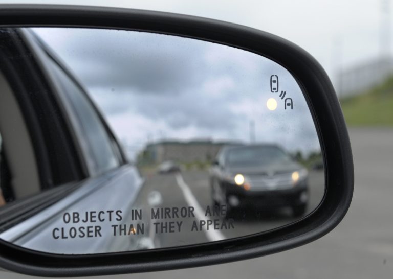 Federal officials are planning to announce Monday whether automakers should be required to equip new cars and light trucks with technology that enables vehicles to communicate with each other to prevent collisions. Such vehicle-to-vehicle communication could transform traffic safety. (AP/Susan Walsh)