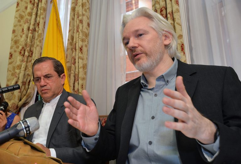WikiLeaks founder Julian Assange, right, speak during a news conference inside the Ecuadorian Embassy in London. (John Stillwell/Pool Photo via AP, File)