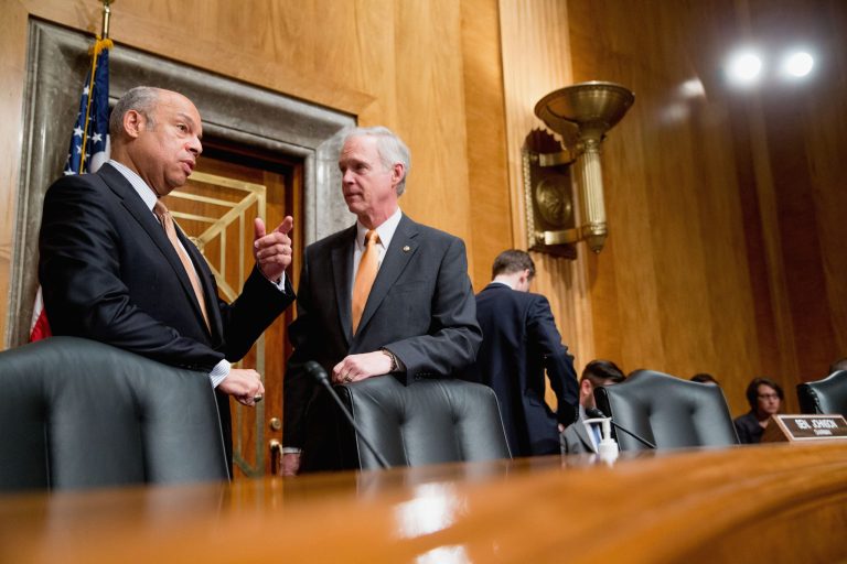 Homeland Security Secretary Jeh Johnson, left, talks with Senate Homeland Security and Governmental Affairs Committee Chairman Sen. Ron Johnson, R-Wis. (AP Photo/Andrew Harnik)