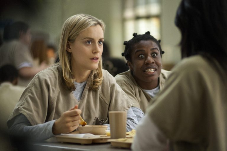 FILE - This image released by Netflix shows Taylor Schilling, left, and Uzo Aduba in a scene from 