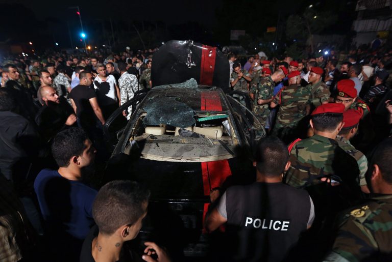 Lebanese army and citizens gather at the site of a car bombing in a southern suburb of Beirut, Lebanon, Tuesday, June 24, 2014. A powerful car bomb explosion rocked a neighborhood south of the Lebanese capital Tuesday, causing several casualties, a Lebanese security official and witnesses said. (AP Photo/Bilal Hussein)