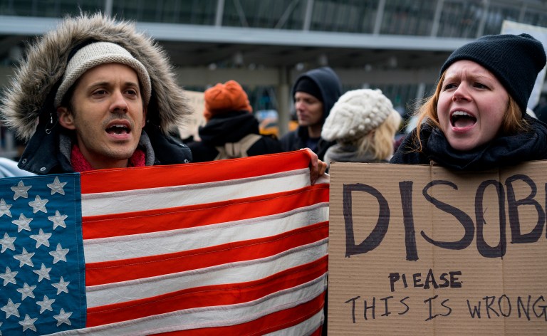 The order applies to green card holders and individuals who have already been approved to enter the country, leading to confusion as refugees who were in transit to the United States were detained upon arrival on Friday. (AP Photo/Craig Ruttle)