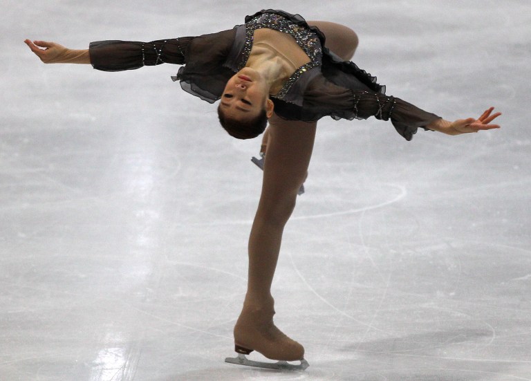   Korean Olympic champion Kim Yu-na performs during her comeback at the Figure Skating NRW Trophy in Dortmund, Germany, Sunday, Dec. 9, 2012. (AP Photo/Frank Augstein)  