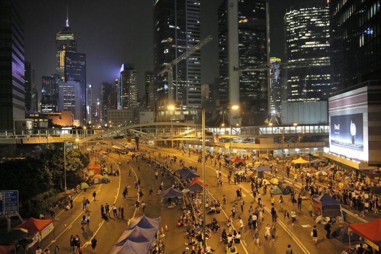 The heart of Hong Kong's business district where demonstrators are blocking streets in Hong Kong, Tuesday, Oct. 7, 2014. Crowds of protesters who filled Hong Kong's streets with demands for more democracy thinned dramatically Tuesday after student leaders and the government agreed to hold talks in the increasingly frustrated city. (AP Photo/Vincent Yu)