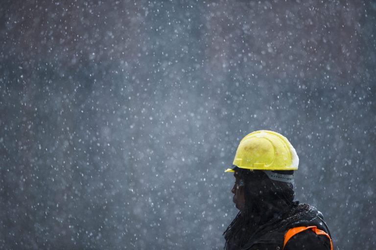 FILE - In this  Monday, Feb. 3, 2014,  file photo, a construction worker unloads rebar in the Brooklyn borough of New York. The Commerce Department reports on U.S. home construction in February on Tuesday, March 18, 2014. (AP Photo/Matt Rourke)