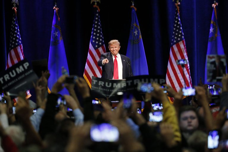 Shortly after the self-funded billionaire invited a supporter on stage Monday to describe the killing of his son by an illegal immigrant, a heckler began shouting about gun control and was removed by security. (AP Photo/John Locher)