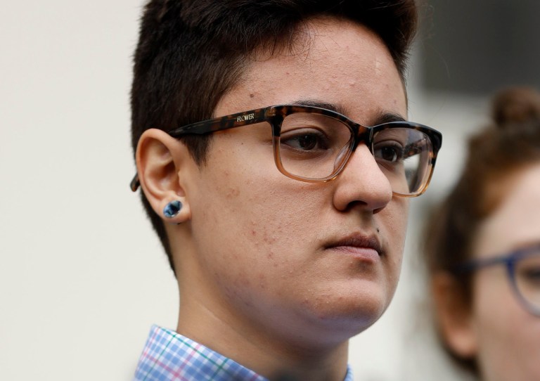 Daniela Vargas, whose father and brother were picked up during a recent immigration raid of undocumented immigrants listens as speakers discuss the series of raids that also picked up other undocumented immigrants across the state during a news conference at the Jackson, Miss., city hall, Wednesday, March 1, 2017. Vargas was detained by ICE agents following the news conference. A college student, Vargas hopes to continue her education but fears for the fate of other undocumented immigrant families. (AP Photo/Rogelio V. Solis)