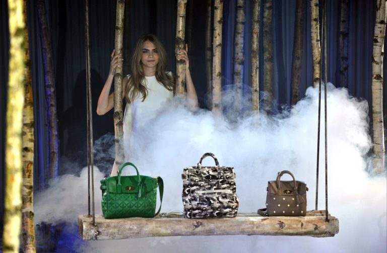 Cara Delevingne models The Cara Delevingne Collection created by Mulberry at London Fashion Week Autumn/ Winter 2014 on Sunday, Feb. 16, 2014 at Claridges in London. (Photo by Richard Chambury/Invision/AP Images)