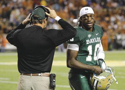 Tony Gutierrez/APBaylor quarterback Robert Griffin III will have to prove he can understand an NFL playbook and defenses despite not playing in a pro-style offense in college.