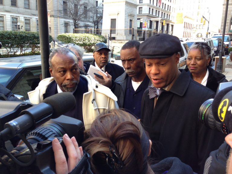 Julius Henson, left, and his lawyer, Russell A. Neverdon Sr., right, speak to the media outside of the Baltimore City Circuit Court Building Thursday, Feb. 27, 2014, in Baltimore. Judge Emanuel Brown ruled Thursday that Henson, convicted in a robocall conspiracy, must serve four months for violating his probation by filing to run for state Senate. Brown suspended his order for 30 days so Henson can appeal. (AP Photo/The Daily Record, Danny Jacobs)