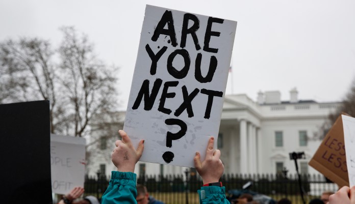 Hundreds of teenage students marched to the White House Monday to stage a "lie-in" for three minutes, the amount of time a gunman spent roaming the halls of a Parkland, Fla., high school last week, killing 17. (AP Photo/Evan Vucci)