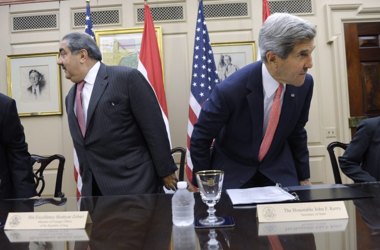   Secretary of State John Kerry and Iraqi Foreign Minister Hoshyar Zebari take their seats at the State Department in Washington, Thursday, Aug. 15, 2013, before a meeting. Kerry met Thursday with the foreign minister, and said that since he visited Baghdad in March, some progress has been made to stop Iraq from being a transit zone for weapons. But he says 
