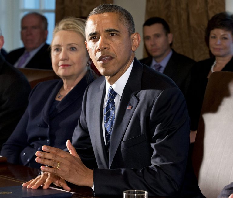 Former Secretary of State Hillary Clinton listens as President Obama speaks in the Cabinet Room at the White House. (AP Photo/Jacquelyn Martin, File)