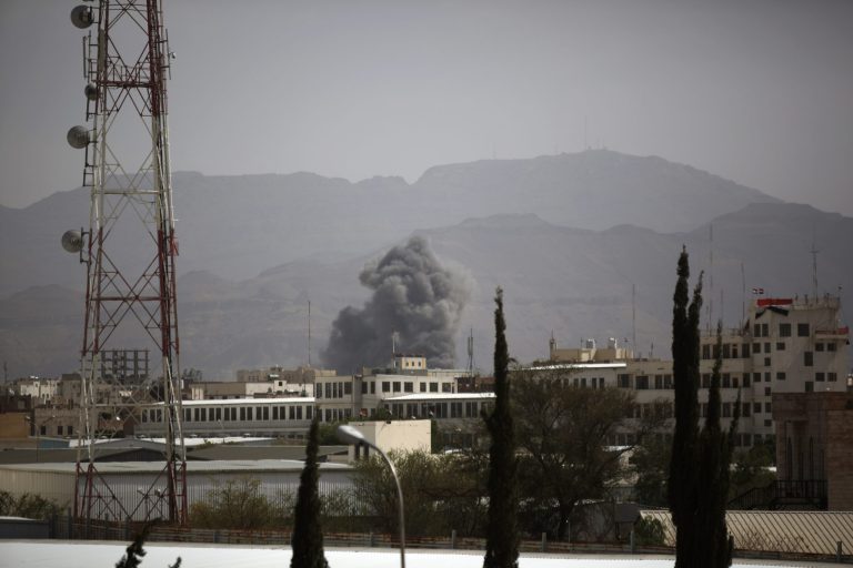 Smoke rises after a Saudi-led airstrike hit a site believed to be one of the largest weapons depot on the outskirts of Yemen's capital, Sanaa, on Wednesday June 3, 2015. (AP Photo/Hani Mohammed)