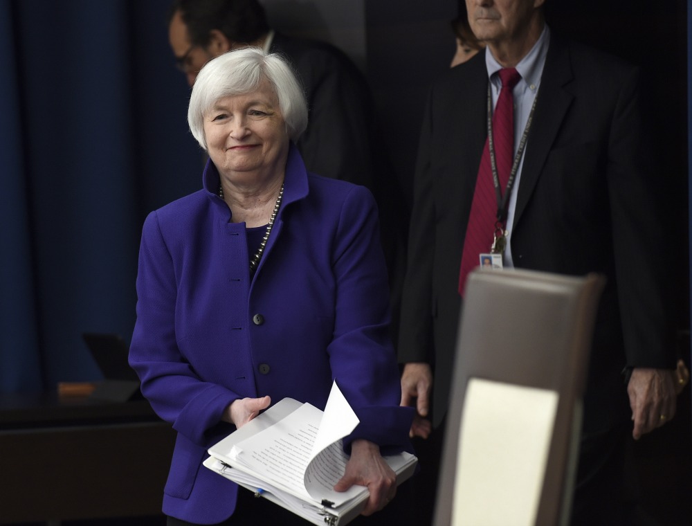 Fed sees risks, leaves rates unchanged