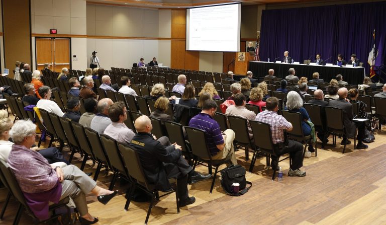 Virginia Fraser, senior manager with Deloitte Consulting, addresses the Town Hall Meeting on cuts on regents campuses held at the University of Northern Iowa Monday, Oct. 6, 2014, in Cedar Falls, Iowa. Deloitte Consulting, retained by the Iowa Board of Regents, has been reimbursed $366,000 for expenses submitted without receipts, but will face tighter oversight going forward, the Iowa Board of Regents said Tuesday, Oct. 7.  (AP Photo/Waterloo Courier, Matthew Putney)