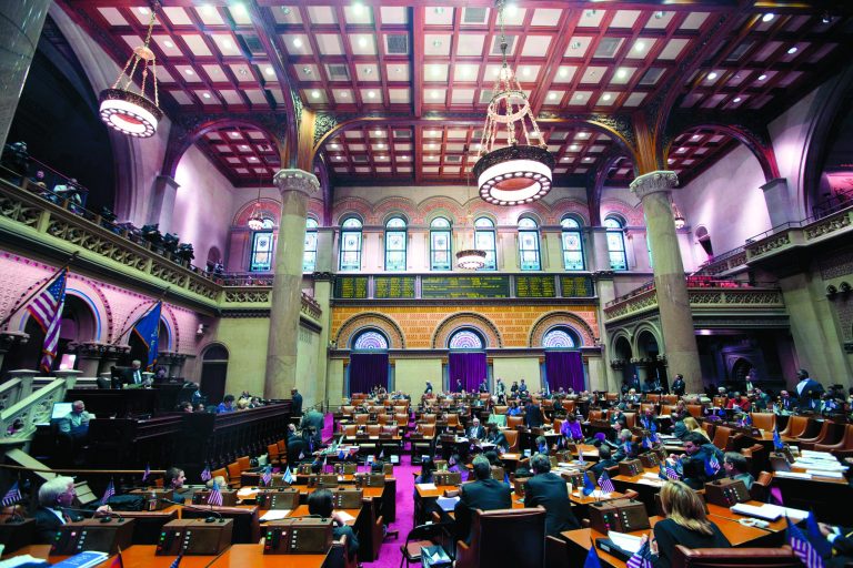 Legislators listen as members explain their vote on New York's Secure Ammunition and Firearms Enforcement Act in the Assembly Chamber at the Capitol on Tuesday, Jan. 15, 2013, in Albany, N.Y. New York's Assembly passed the toughest gun control law in the nation and the first since the Newtown, Conn., school shooting, calling for a tougher assault weapons ban and provisions to try to keep guns out of the hands of the mentally ill who make threats. The measure passed, 104-43. (AP Photo/Mike Groll)