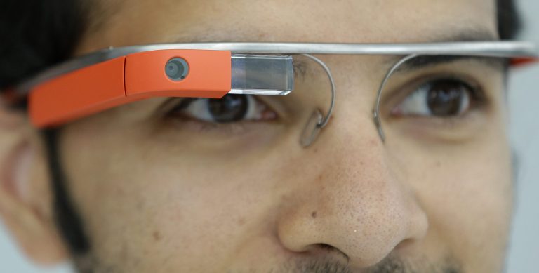 FILE - This May 15, 2013 file shows Google Glasses displayed in San Francisco. Google has chosen five charities to develop ideas using Web-connected Google Glass to enhance their work. After receiving 1,300 proposals, Google is announcing five nonprofits Wednesday that will receive a free pair of the glasses, a $25,000 grant and support from developers.  (AP Photo/Jeff Chiu, File)