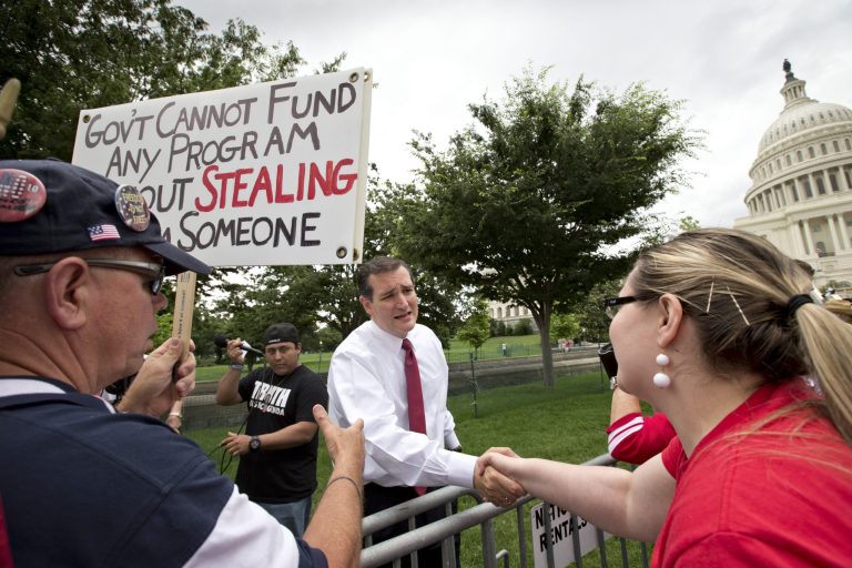 Sen. Ted Cruz, R-Texas, greets supporters after addressing thousands of tea party activists at the U.S. Capitol railing against the Internal Revenue Service, illegal immigration, and the Obama administration, in Washington, Wednesday, June 19. Cruz, along with activists from Dallas, Houston, San Antonio and Waco promised patience and perseverance, contending that most Americans have yet to grasp the full extent of what they've been through.  (AP Photo/J. Scott Applewhite)