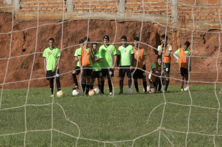 In this May 28, 2014 photo, players from the Presidente Prudente soccer club's under 16 category train in Presidente Prudente, Brazil. Professional soccer in the World Cup host nation is struggling, with lower-division teams unable to play enough games, players forced to take multiple jobs and even top-tier teams competing in mostly empty stadiums. (AP Photo/Andre Penner)