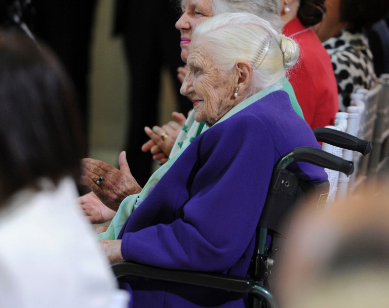   FILE - In a Oct. 26, 2011 file photo, Dame Elisabeth Murdoch sits in the audience as Queen Elizabeth II visits the Royal Children's Hospital in Melbourne. Dame Elisabeth Murdoch, a prominent Australian philanthropist and mother of media mogul Rupert Murdoch, died late Wednesday, Dec. 5, 2012 in Melbourne, according to News Ltd., the Australian media company headed by her son. She was 103. (AP Photo/Julian Smith, Pool, File)  