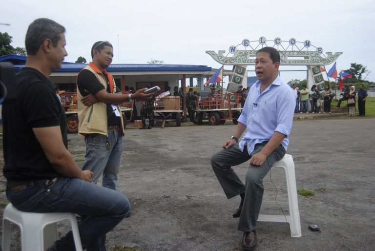   In this photo taken on Monday June 11, 2012 veteran Middle Eastern TV reporter Baker Atyani, left, interviews Sulu Governor Sakur Tan, right, at the airport in Jolo, the capital of the island province of Sulu in Southern Philippines during his taping of his story of the island, a hotbed of Muslim militants about 950 kilometers (590 miles) south of Manila. Atyani, a Jordanian national who met and interviewed Osama Bin Laden and his aides in Afghanistan months before the Sept.11, 2001 attacks and now Al-Arabiya's TV Bureau Chief for Southeast Asia based in Jakarta, has disappeared with two Filipino crew on a restive Jolo island where militants are active, officials said Friday June 15, 2012. (AP Photo/Nickee Butlangan)  