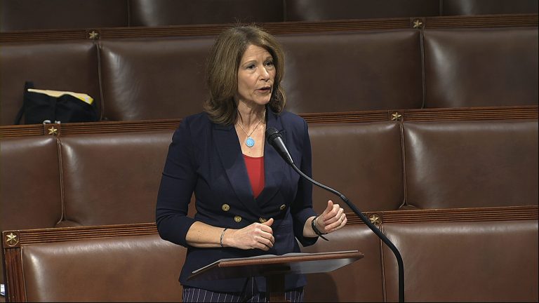 Rep. Cheri Bustos, D-Ill., walks to a group photo with the women of the 116th Congress on Capitol Hill in Washington, Friday, Jan. 4, 2019.