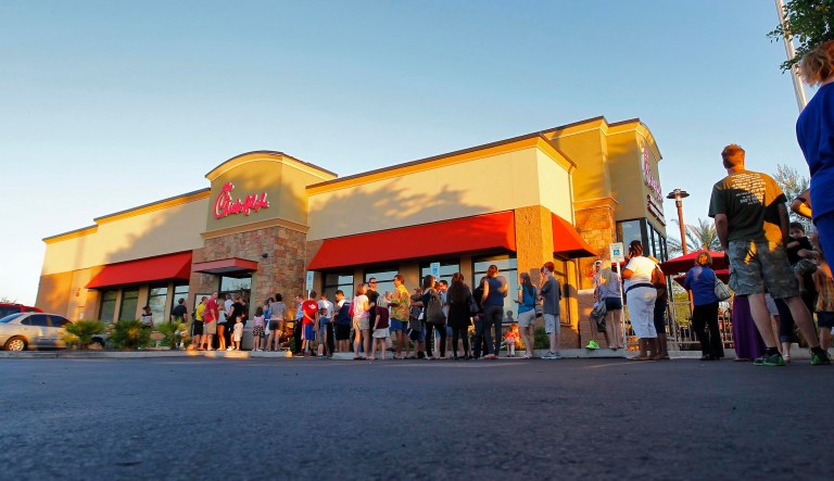 Customers gather by the hundreds outside the Gilbert, Ariz Chick-fil-A restaurant, Wednesday, Aug. 1, 2012. Chick-fil-A supporters are packing the chicken chain's restaurants as the company continues to be criticized for an executive taking a public position against same-sex marriage. Former Arkansas Gov. Mike Huckabee, a Baptist minister, declared Wednesday "Chick-fil-A Appreciation Day."