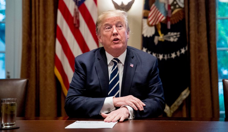 President Donald Trump speaks to members of the media as he meets with members of Congress in the Cabinet Room of the White House, Tuesday, July 17, 2018, in Washington.