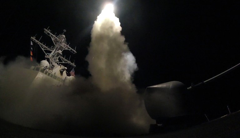 In this image provided by the U.S. Navy, the guided-missile destroyer USS Porter (DDG 78) launches a tomahawk land attack missile in the Mediterranean Sea, Friday, April 7, 2017. The United States blasted a Syrian air base with a barrage of cruise missiles in fiery retaliation for this week's gruesome chemical weapons attack against civilians.
