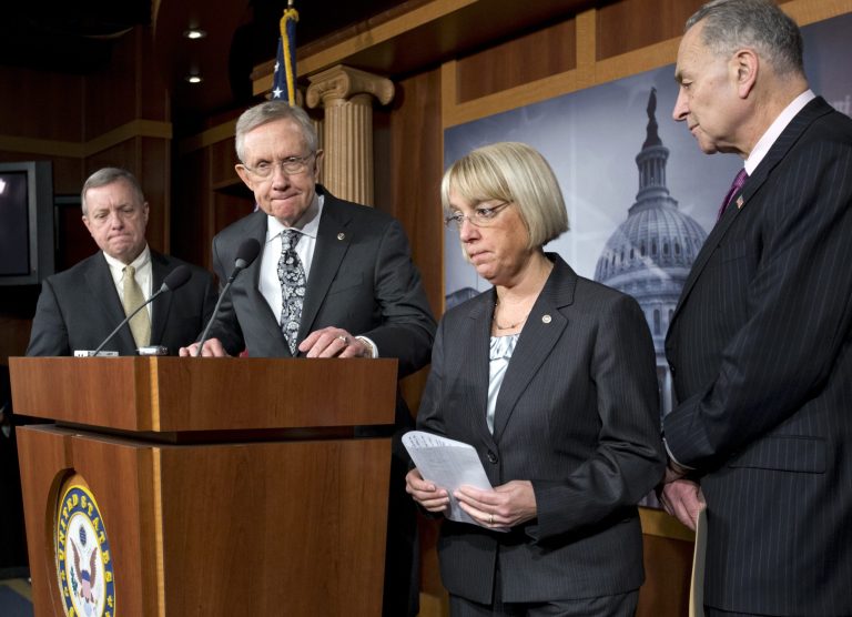   Senate Majority Leader Harry Reid of Nev., second from left, accompanied by fellow Senate Democratic leaders, pauses during a news conference on Capitol Hill in Washington, Thursday, Dec. 13, 2012, to discuss the stalled fiscal cliff negotiations and other unfinished business in the Senate. From left are, Senate Majority Whip Richard Durbin of Ill., Reid, Sen. Patty Murray, D-Wash., and Sen. Charles Schumer, D-N.Y. (AP Photo/J. Scott Applewhite)  