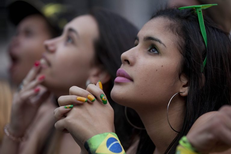 Fans watch a live telecast of the Mexico vs. Brazil match at the FIFA Fan Fest during the 2014 soccer World Cup in Sao Paulo, Brazil, Tuesday, June 17, 2014. Mexico claimed a deserved point against Brazil in a largely frustrating Group A game which finished 0-0 at Estadio Castelao in Fortaleza. (AP Photo/Dario Lopez-Mills)