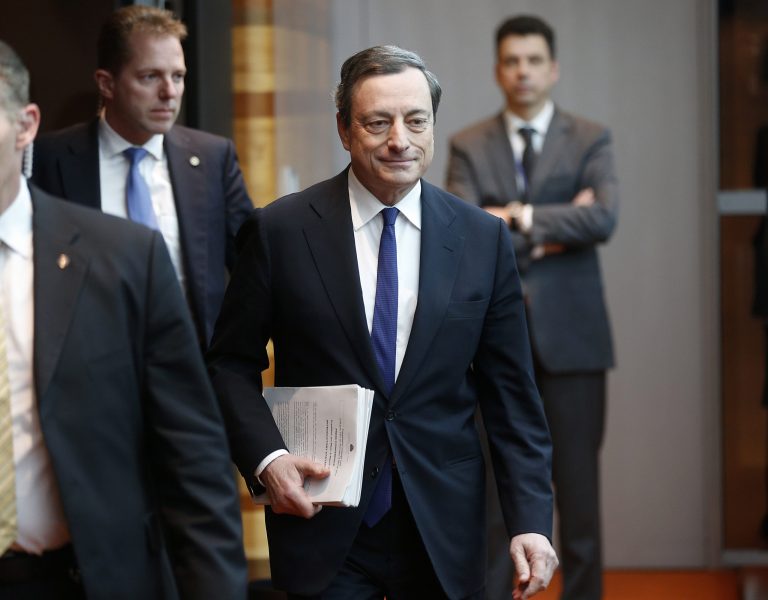 President of European Central Bank Mario Draghi is on his way to a news conference in Frankfurt, Germany, Thursday, March 6, following a meeting of the ECB governing council. The European Central Bank has kept its main interest rate at a record low of 0.25 percent, holding off on more stimulus as economic indicators suggest the modest recovery is gaining strength. (AP Photo/Michael Probst)
